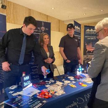 Cybersecurity Center of Excellence table at the Roundhouse